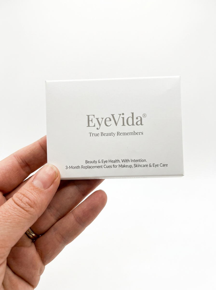 EyeVida sticker kit styled as a beauty gift on a soft cream background